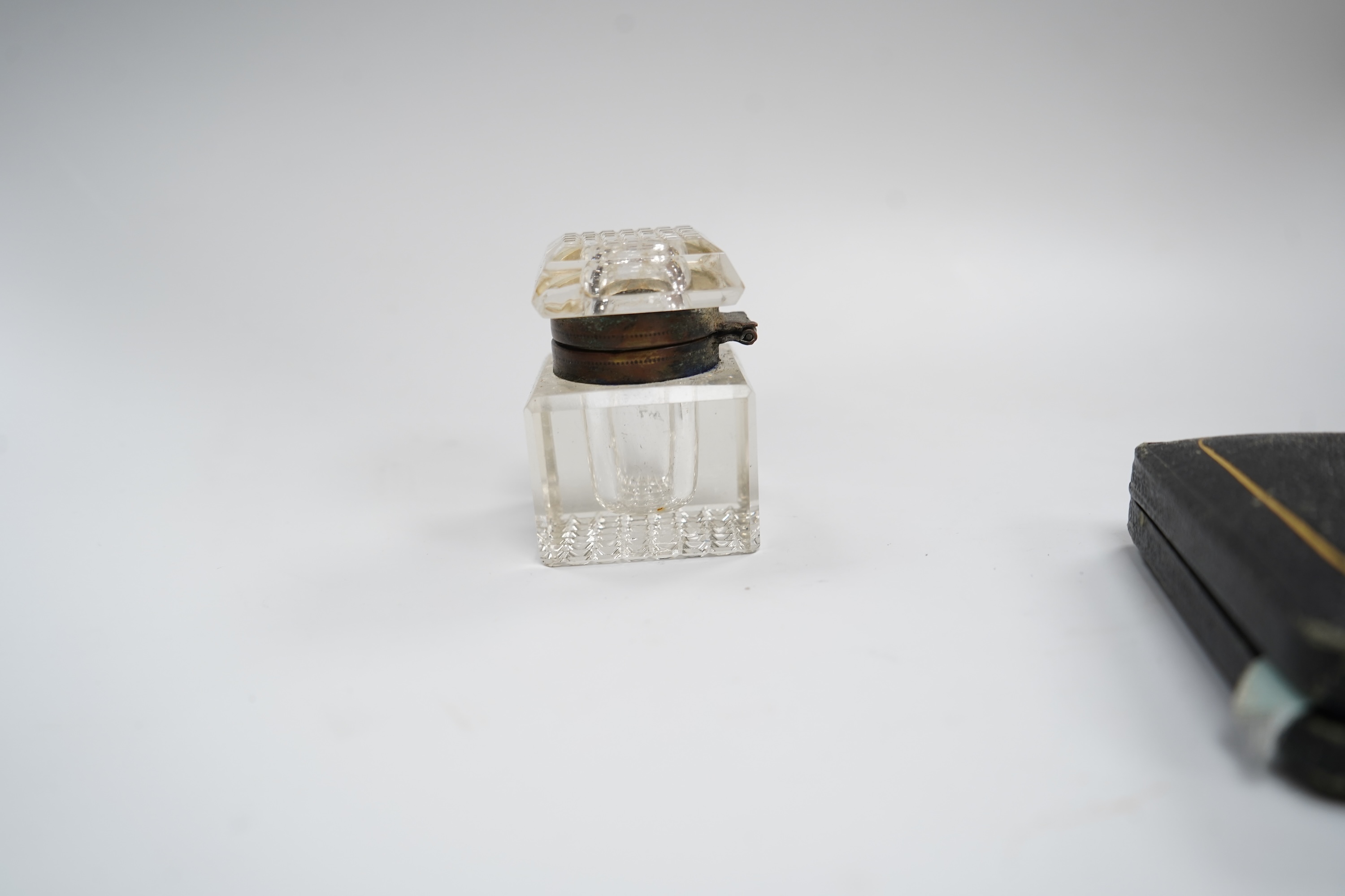 A box of cut glass drops, together with box of gaming counters, a gilt metal cross, an Art Deco ceramic nude figure, two frames, a parker pen, etc.
